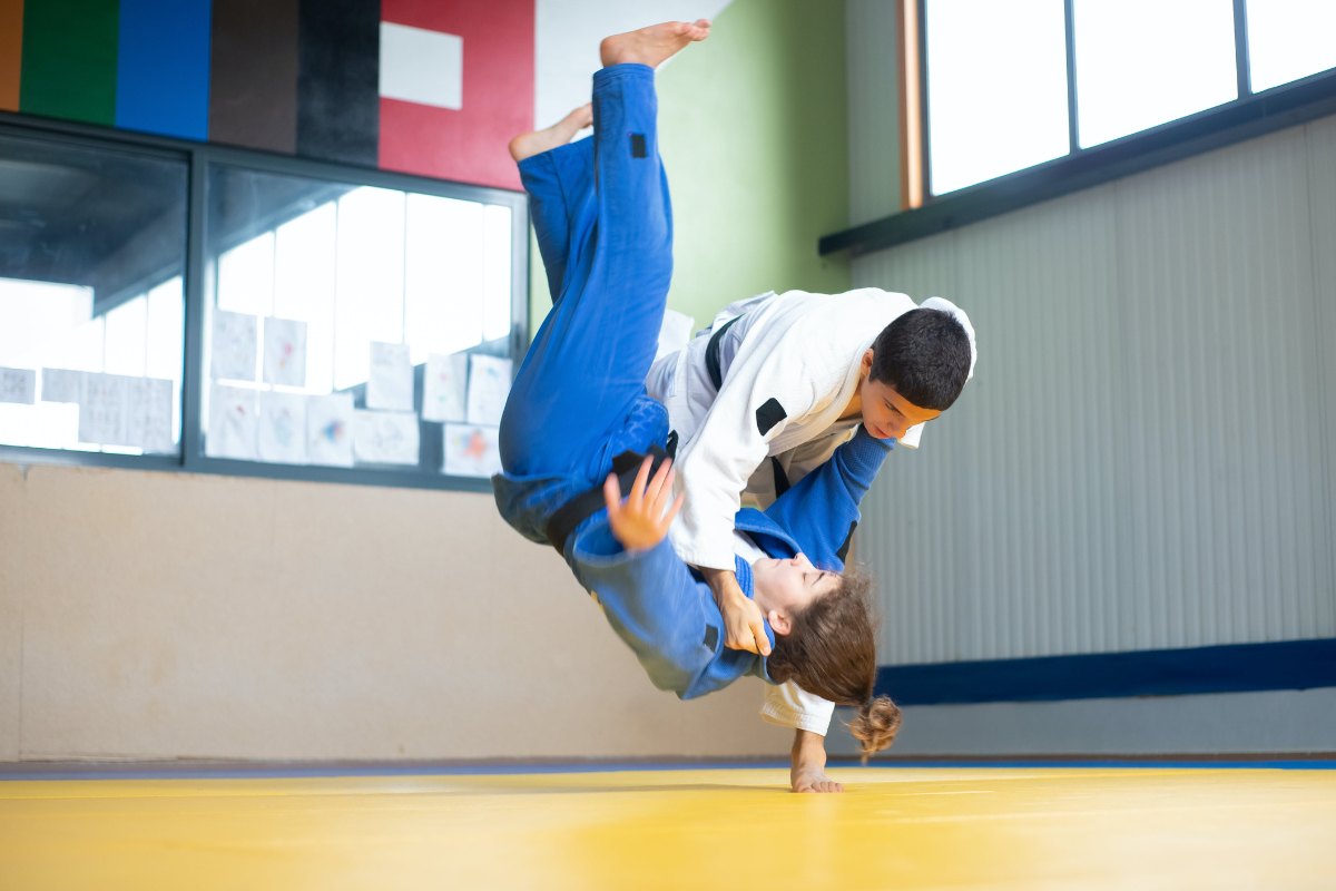 People on a mat practicing Brazilian Jiu-Jitsu