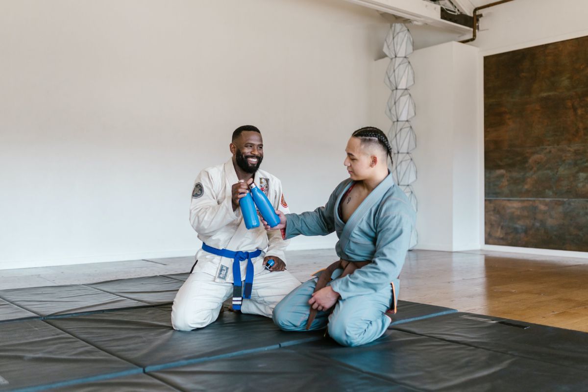 Two men resting after a bout